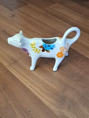 White Ceramic Cow Creamer with Multicolor Floral Motif